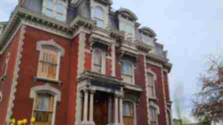 Brown brick and stone mansion in Binghamton, NY.
