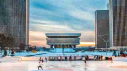 People ice skating at the Empire State Plaza ice rink