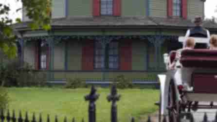 A family on a horse-drawn carriage at the Genesee Country Village