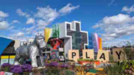 The Strong Museum of Play's Hasbro Game Park with giant Scrabble letters spelling the word "Play", a giant dog game piece, and other board game displays.