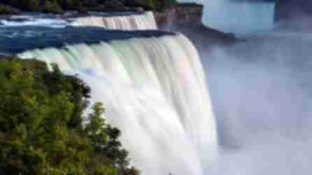 A view of Niagara Falls showing the white water going over a steep drop